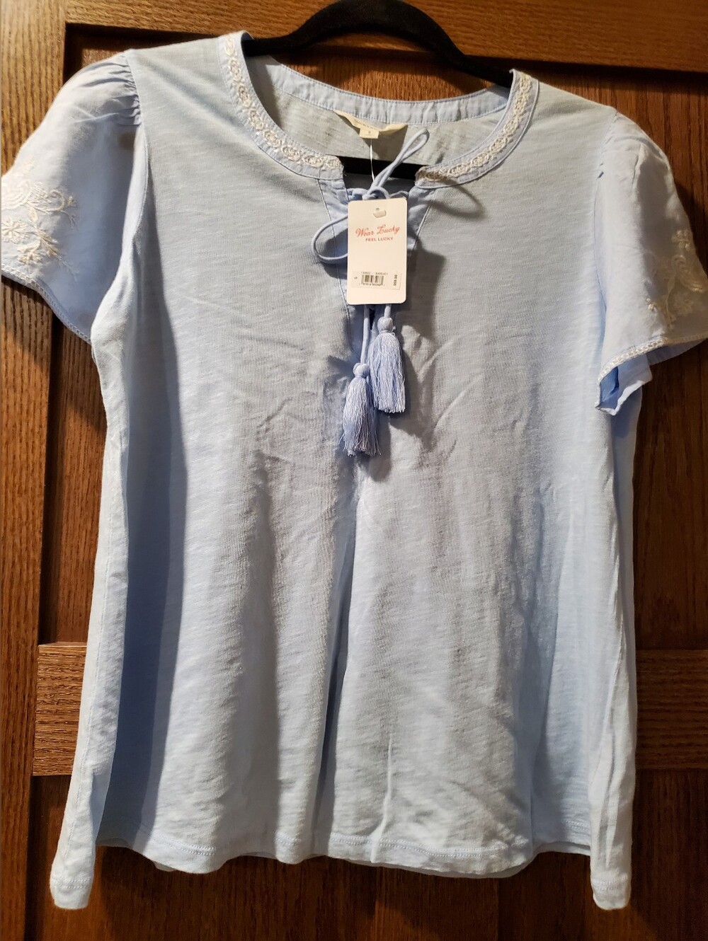 size S Lucky Brand Light Blue Tassel Tie Blouse NWT
